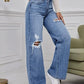 💃 High-Waisted Ripped Wide-Leg Jeans – Designed to elongate the legs and flatter the waist. A loose, relaxed fit through the hip and thigh with a gentle distressed finish. Button fly, floor-skimming hem & effortless cool for every body shape 🌸