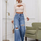 💃 High-Waisted Ripped Wide-Leg Jeans – Designed to elongate the legs and flatter the waist. A loose, relaxed fit through the hip and thigh with a gentle distressed finish. Button fly, floor-skimming hem & effortless cool for every body shape 🌸