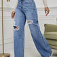 💃 High-Waisted Ripped Wide-Leg Jeans – Designed to elongate the legs and flatter the waist. A loose, relaxed fit through the hip and thigh with a gentle distressed finish. Button fly, floor-skimming hem & effortless cool for every body shape 🌸